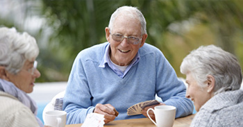 Enjoying cards with friends in retirement